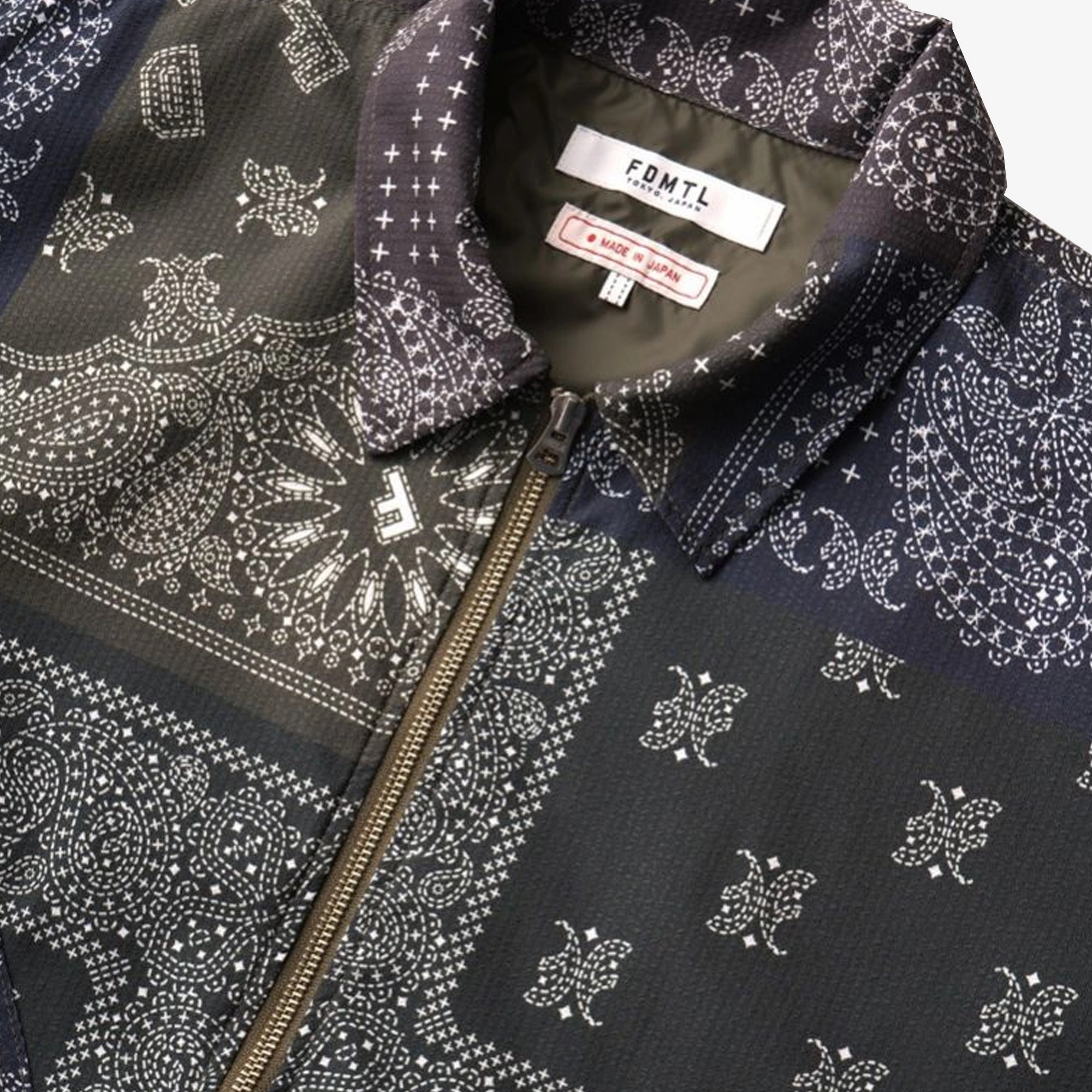 FDMTL | PRINTED PATCHWORK JACKET  { KHAKI